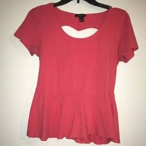 Peplum styled pink top with heart cut out on back!